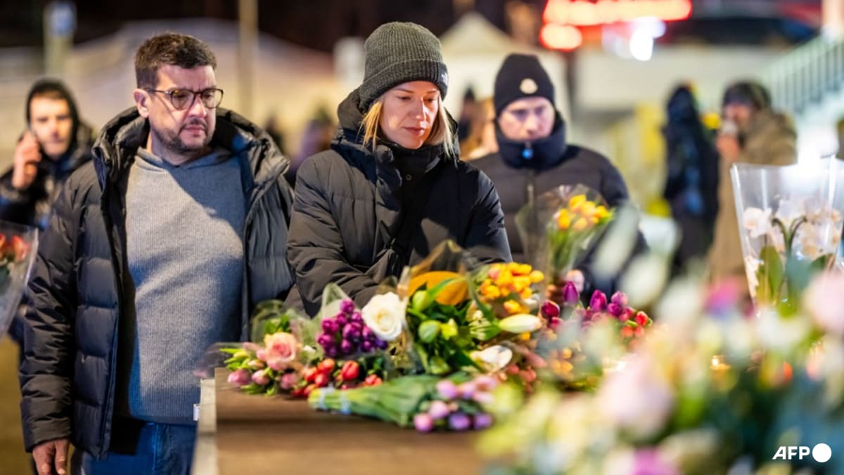 Tears and stunned silence at vigil for Swiss fire victims