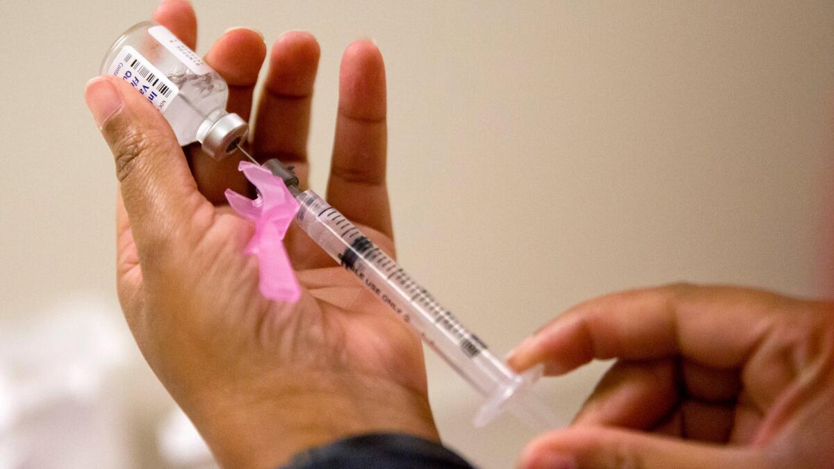 Flu season surged in U.S. over holidays and already rivals last winter's harsh epidemic