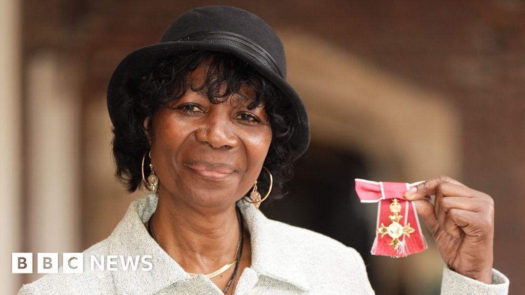 Darts champion Deta Hedman accepts OBE medal from Princess Anne