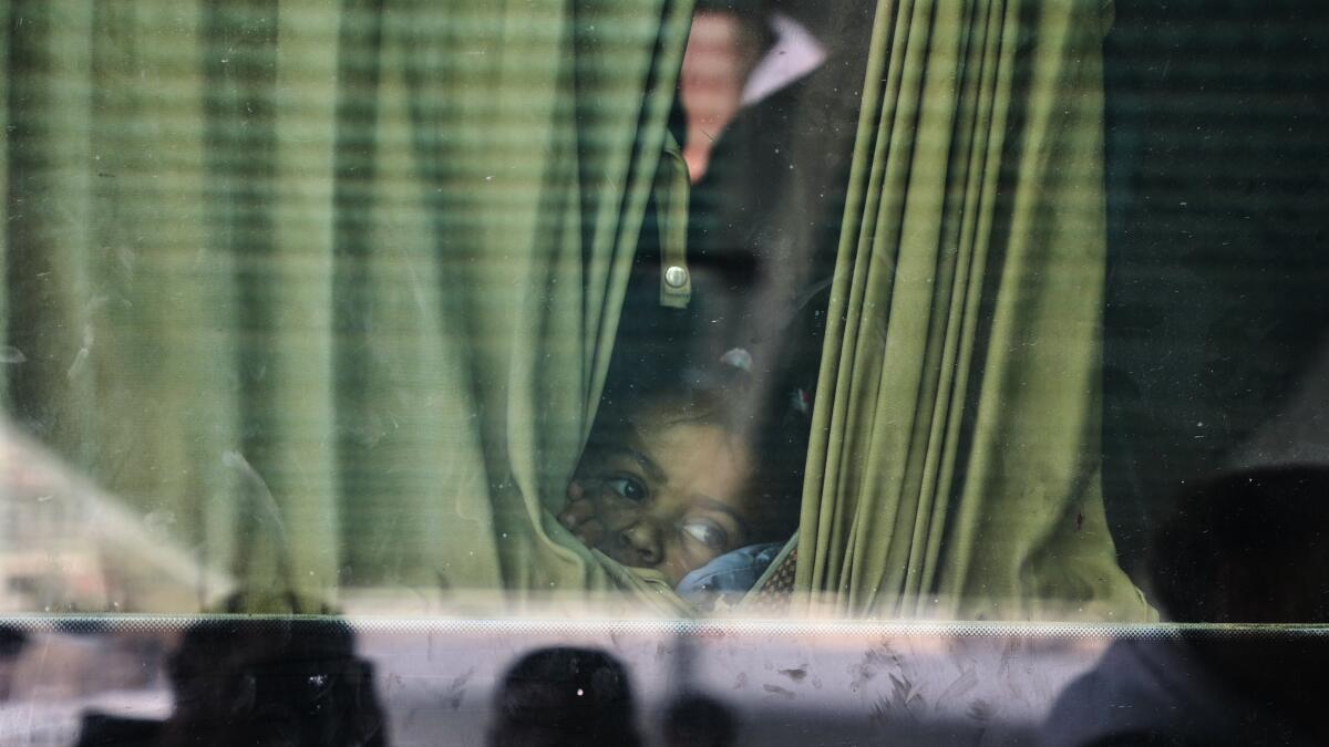 Gaza's border crossing to Egypt reopens in a key step for truce but few Palestinians can cross