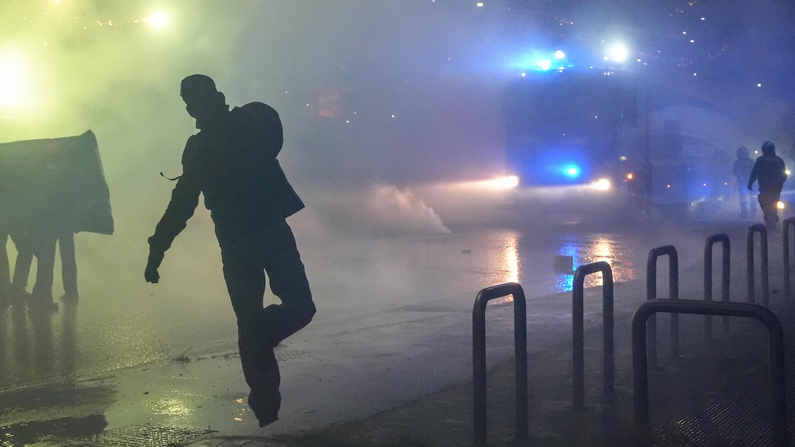 Italian police fire tear gas as protesters clash near Winter Olympics hockey venue