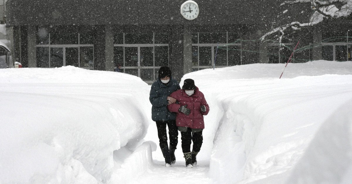 Heavy snow hampers voting in Japan as critics question midwinter election