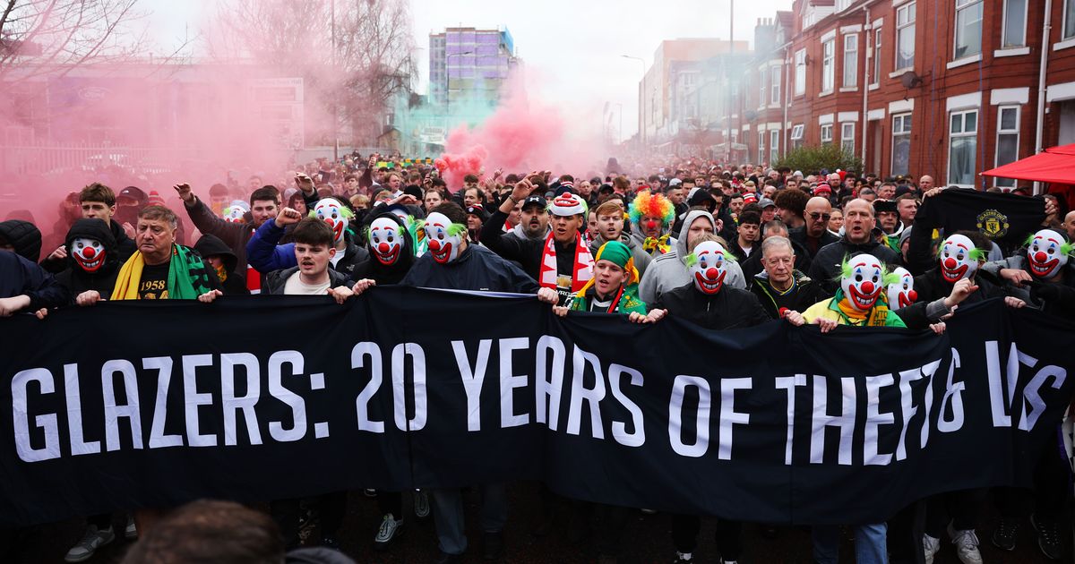 Thousands of Man Utd fans wear clown masks during Glazers and Ratcliffe protest